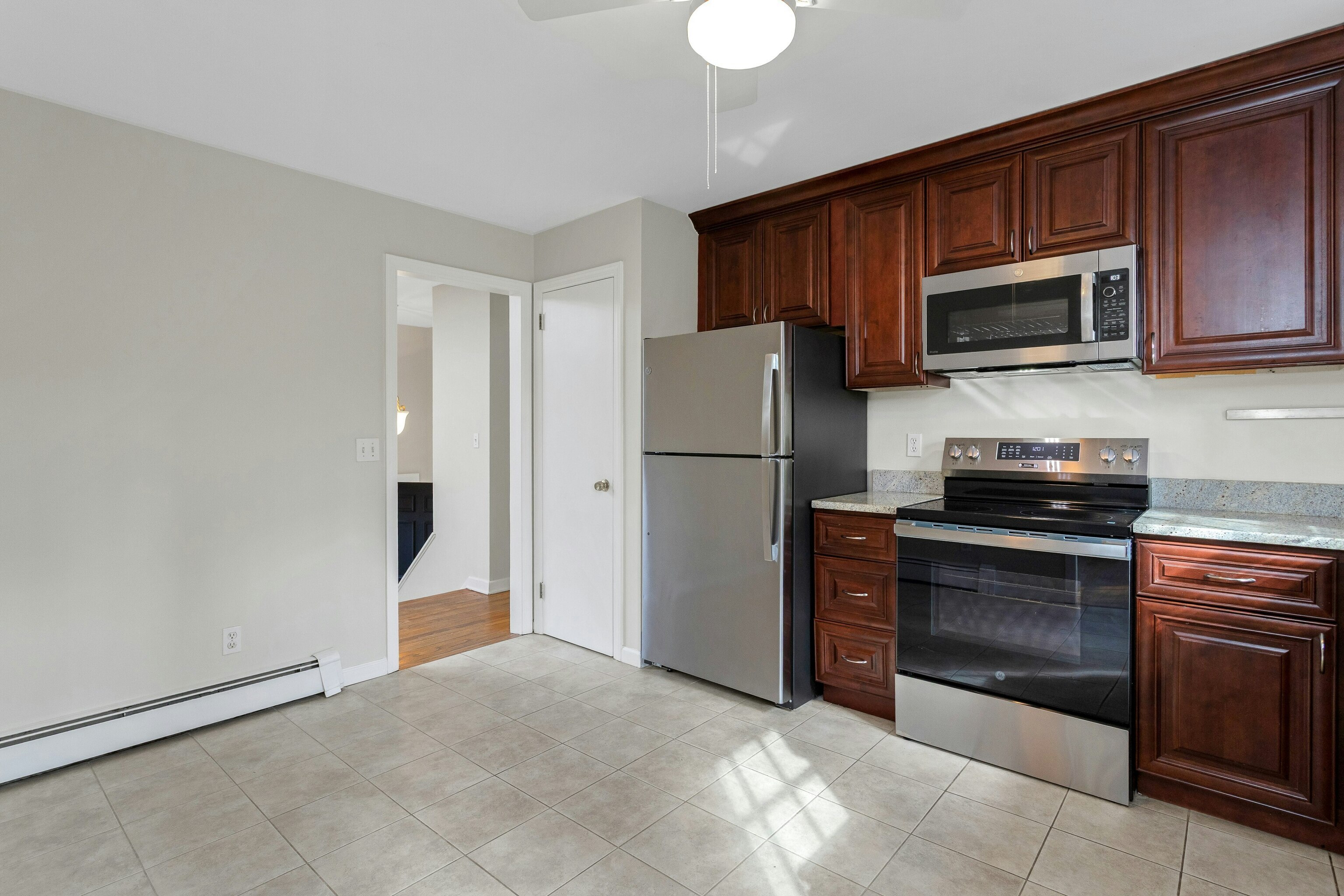 64 Jelliff Mill Road New Canaan, CT 06840 - Photo 9 of 24 a kitchen with stainless steel appliances granite countertop a refrigerator and a stove top oven