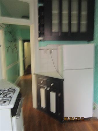 39 Revere Street, Unit 6 Boston, MA 02114 - Photo 4 of 10 a kitchen with a refrigerator and a stove