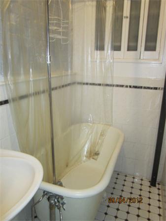 39 Revere Street, Unit 6 Boston, MA 02114 - Photo 10 of 10 a bath tub sitting next to a white toilet and sink