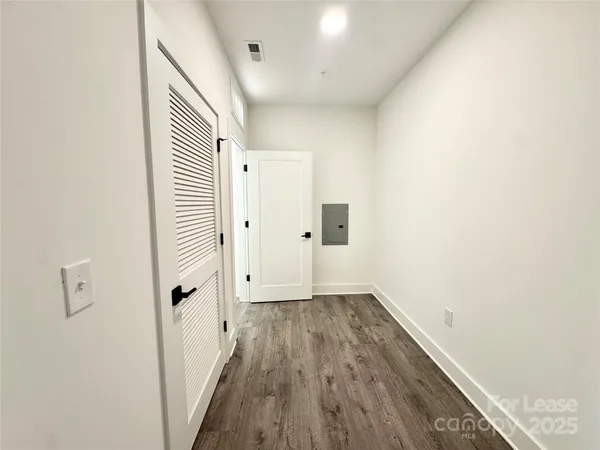 an entryway of a house with wooden floor