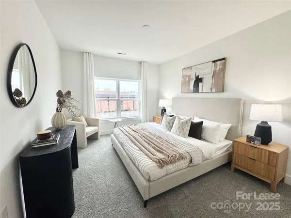 a bedroom with bed and a window