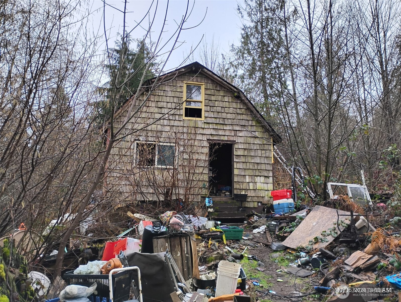 a backyard of a house with seating space
