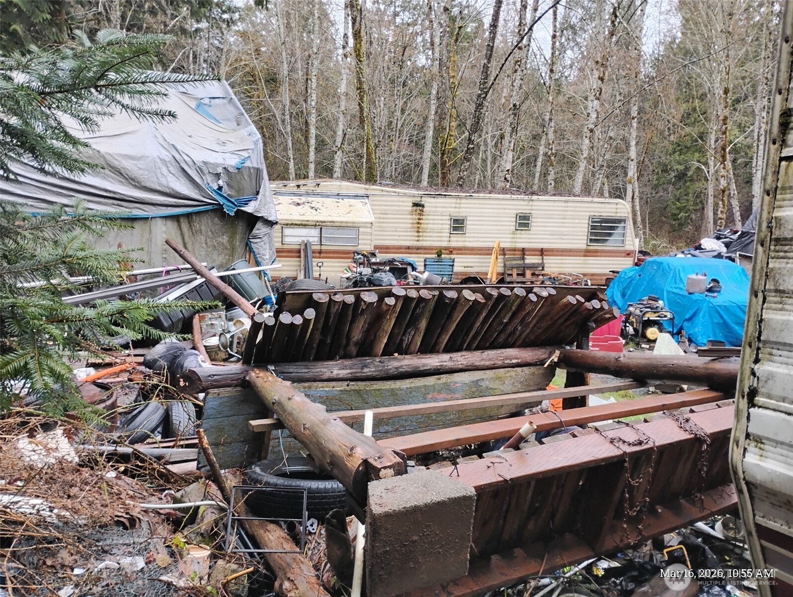 611 East Daniels Road Shelton, WA 98584 - Photo 5 of 11 a view of a patio with table and chairs with wooden floor