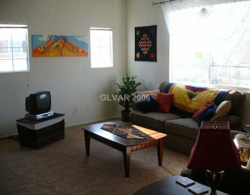 9105 Ripple Ridge Avenue, Unit 101 Las Vegas, NV 89149 - Photo 2 of 8 Living Room.