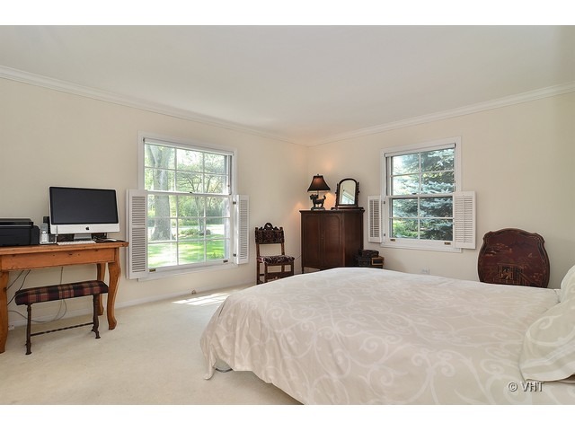 1575 Tower Road Winnetka, IL 60093 - Photo 13 of 21 a bedroom with a bed and a desk
