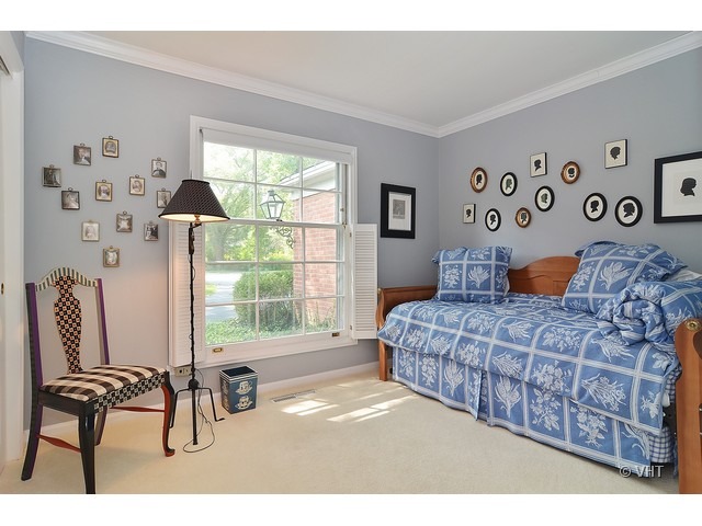 1575 Tower Road Winnetka, IL 60093 - Photo 14 of 21 a bedroom with a large bed and a window