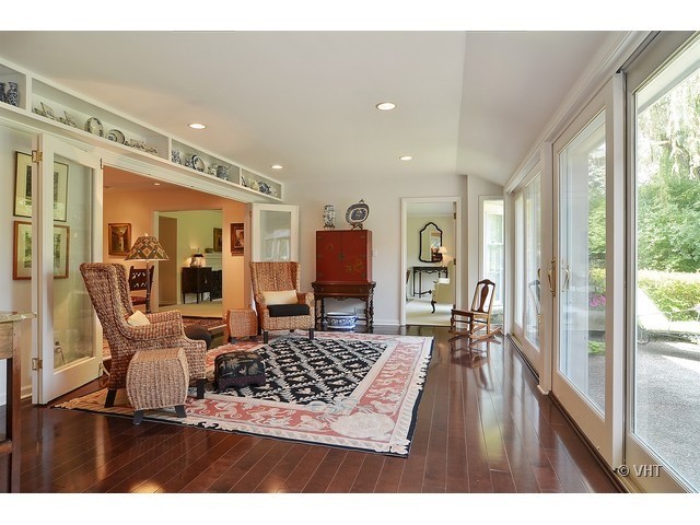 1575 Tower Road Winnetka, IL 60093 - Photo 15 of 21 a living room with furniture and a flat screen tv