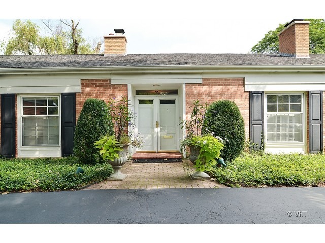 1575 Tower Road Winnetka, IL 60093 - Photo 20 of 21 a front view of a house with a yard