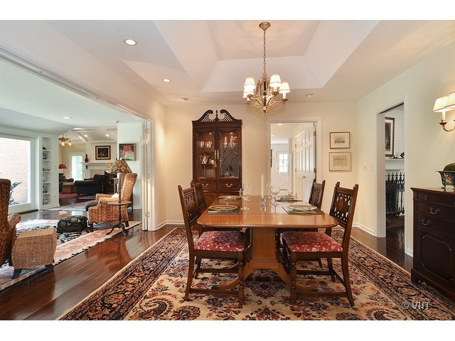 1575 Tower Road Winnetka, IL 60093 - Photo 7 of 21 a view of a dining room with furniture and a chandelier