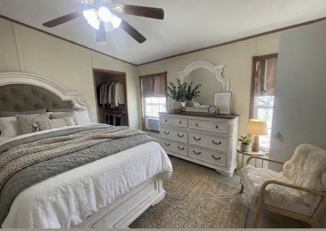 26601 Sun Belt Tool, TX 75143 - Photo 6 of 15 a bedroom with a bed and a mirror on the dresser