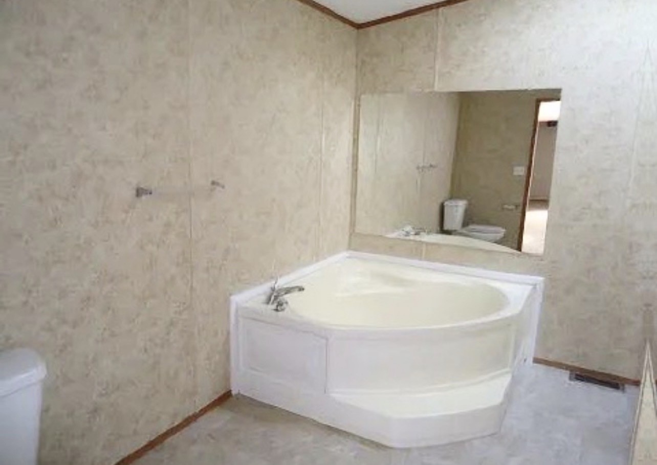 26601 Sun Belt Tool, TX 75143 - Photo 7 of 15 a white bath tub sitting in a bathroom