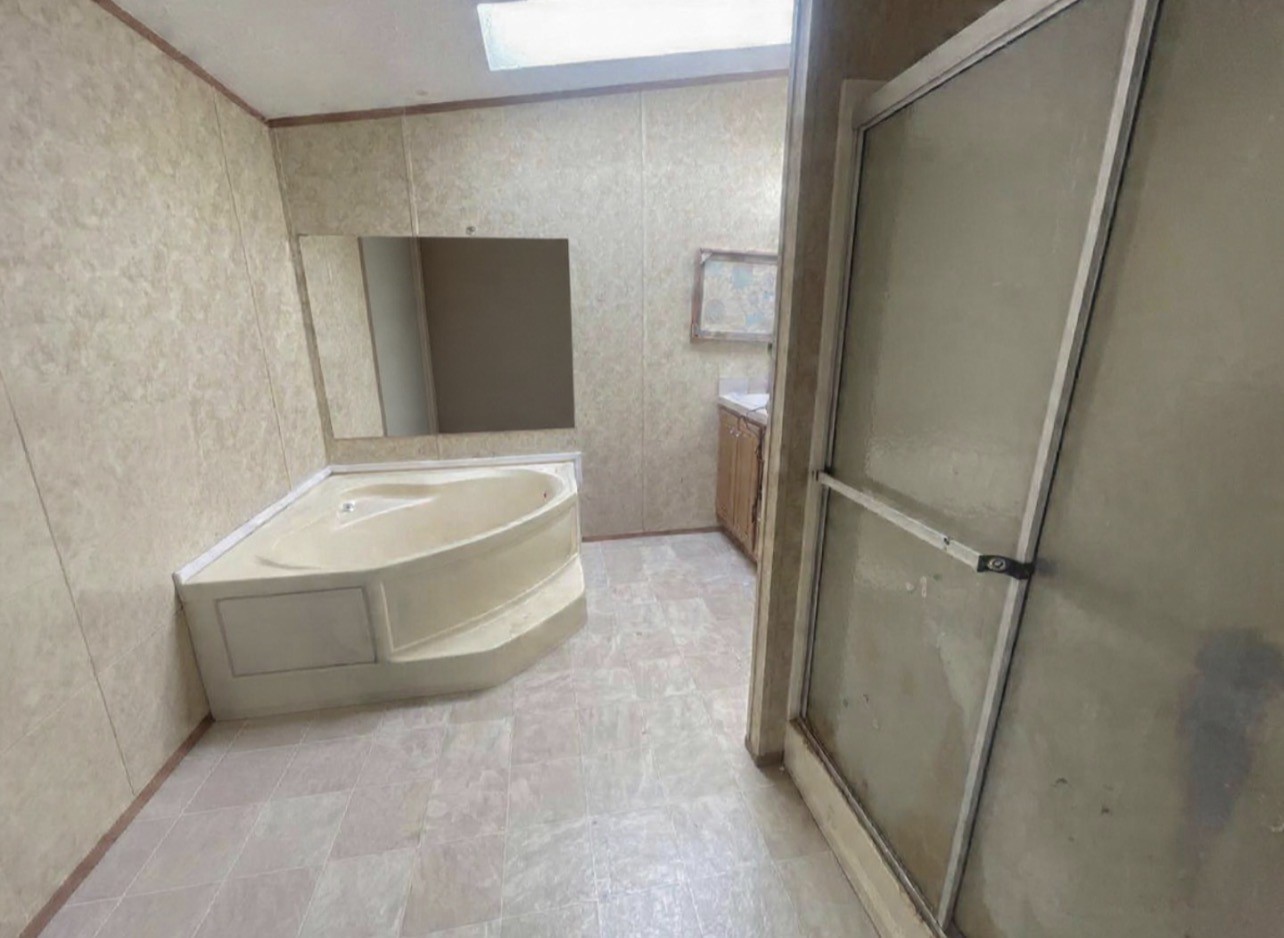 26601 Sun Belt Tool, TX 75143 - Photo 8 of 15 a bathroom with a tub and shower