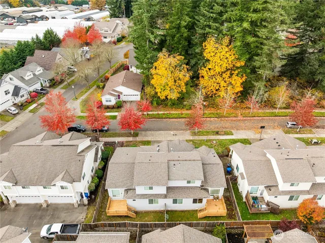 an aerial view of residential houses with outdoor space