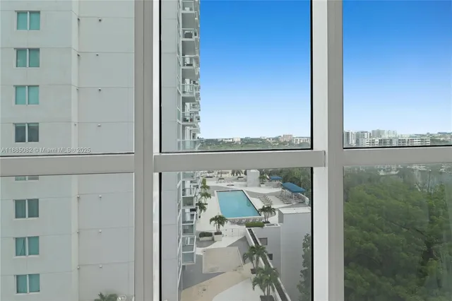 a view of a balcony with furniture and front door