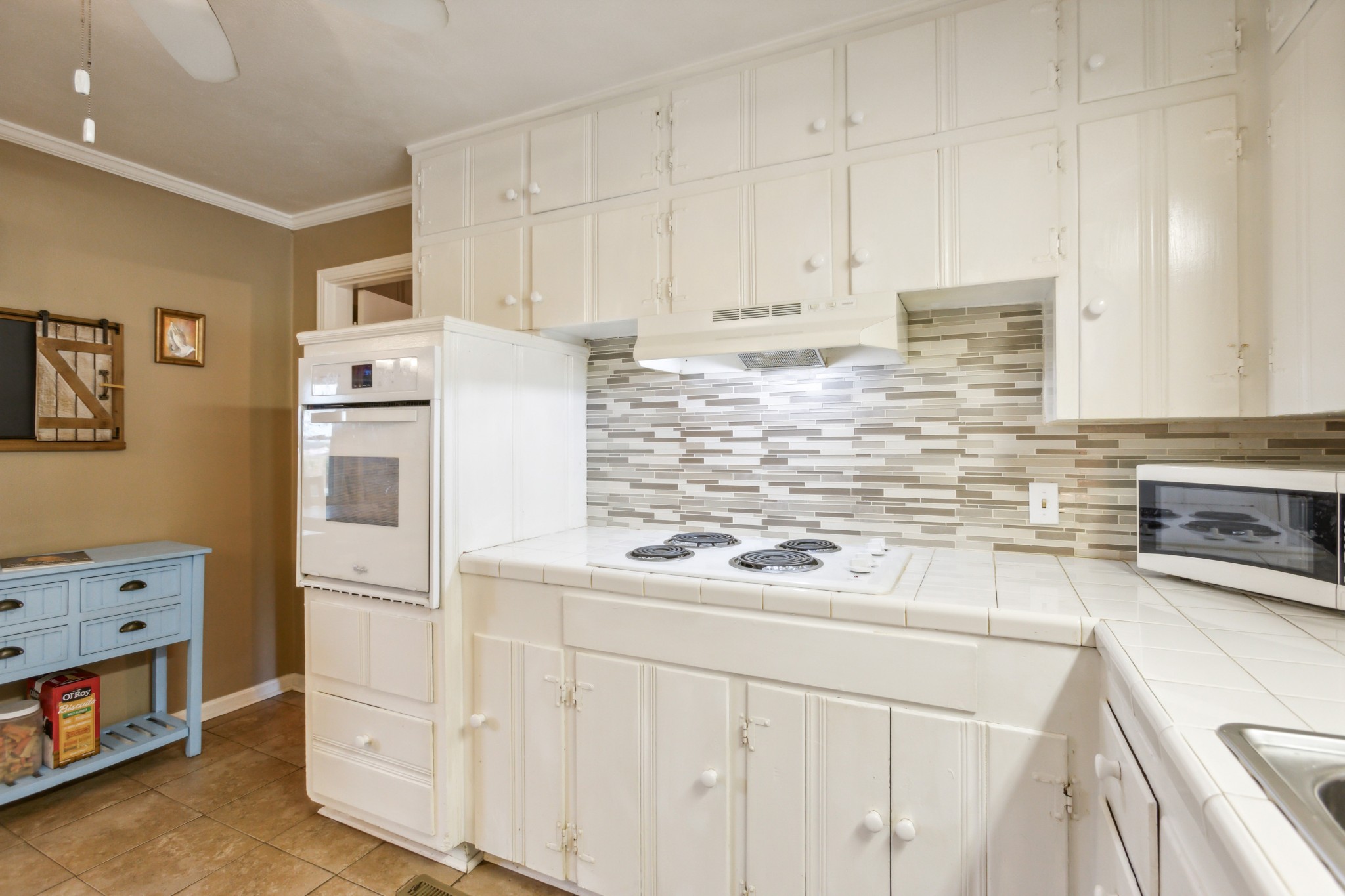 571 Jackson Road Portland, TN 37148 - Photo 11 of 24 a kitchen with stainless steel appliances white cabinets and a refrigerator