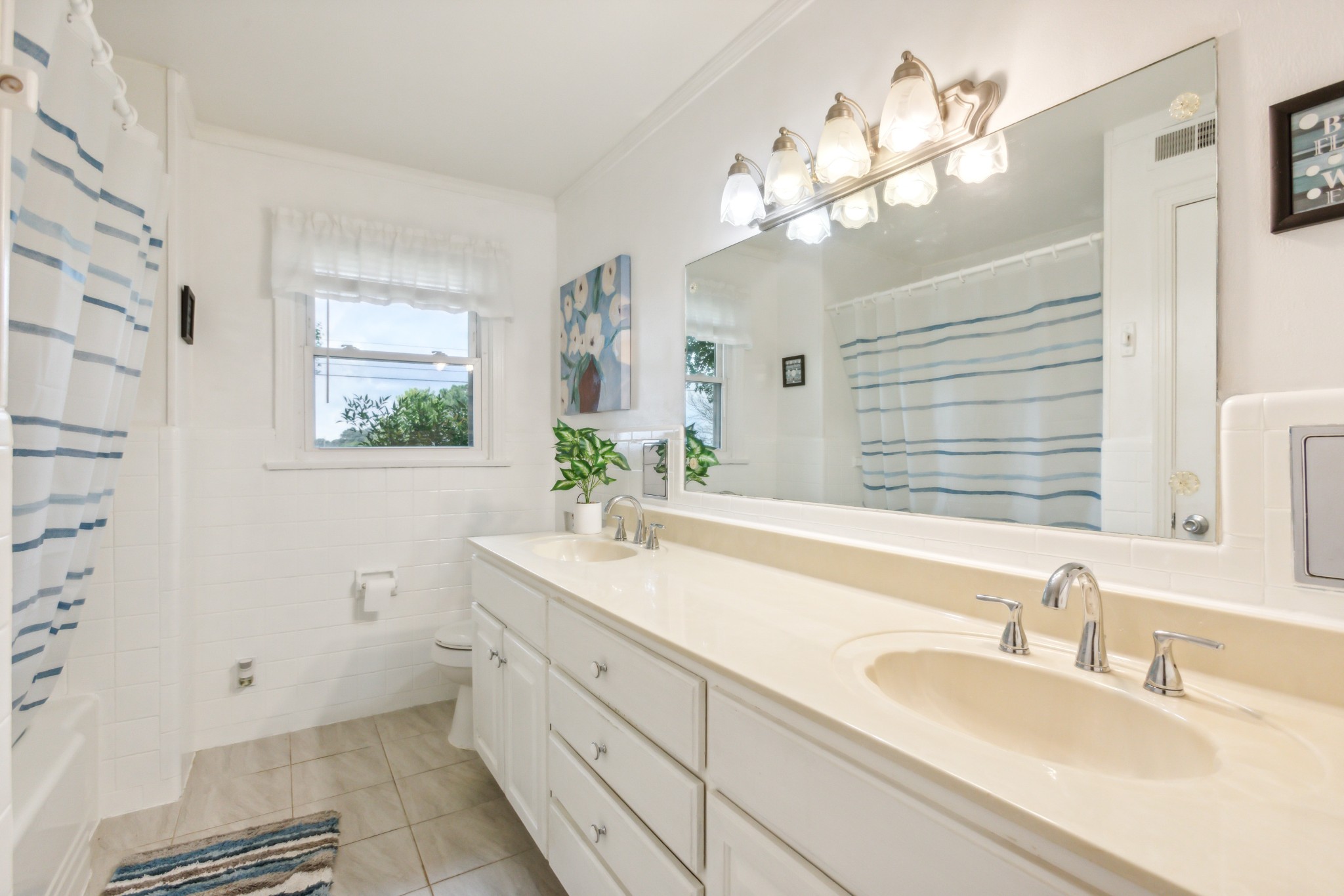 571 Jackson Road Portland, TN 37148 - Photo 13 of 24 a bathroom with a sink a large mirror and a shower