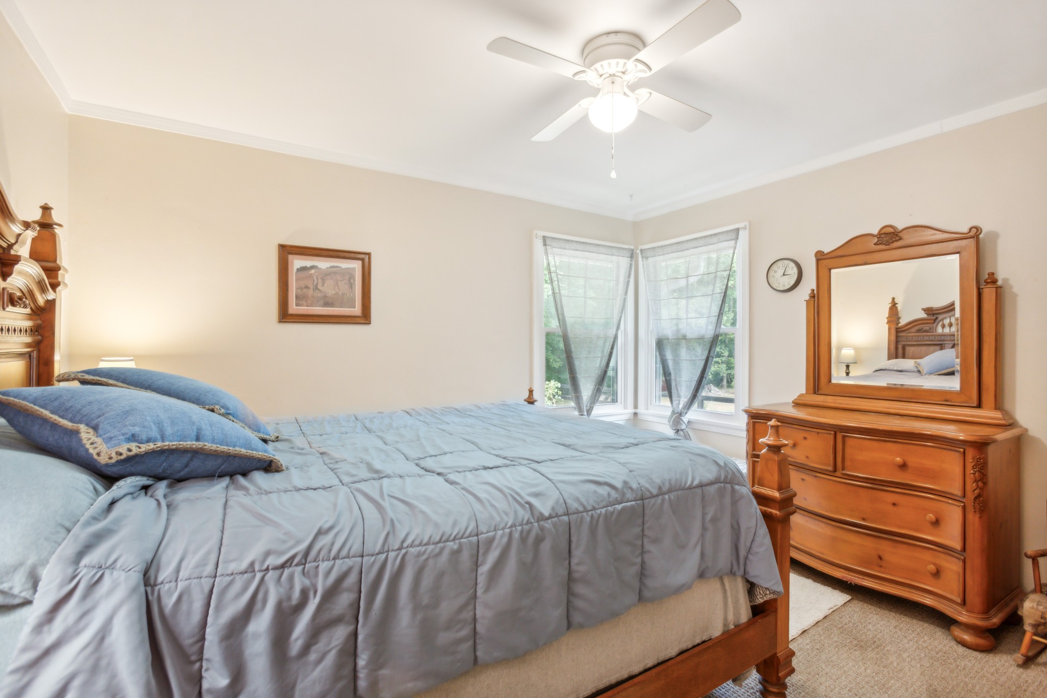 571 Jackson Road Portland, TN 37148 - Photo 15 of 24 a bedroom with a large bed and a chandelier