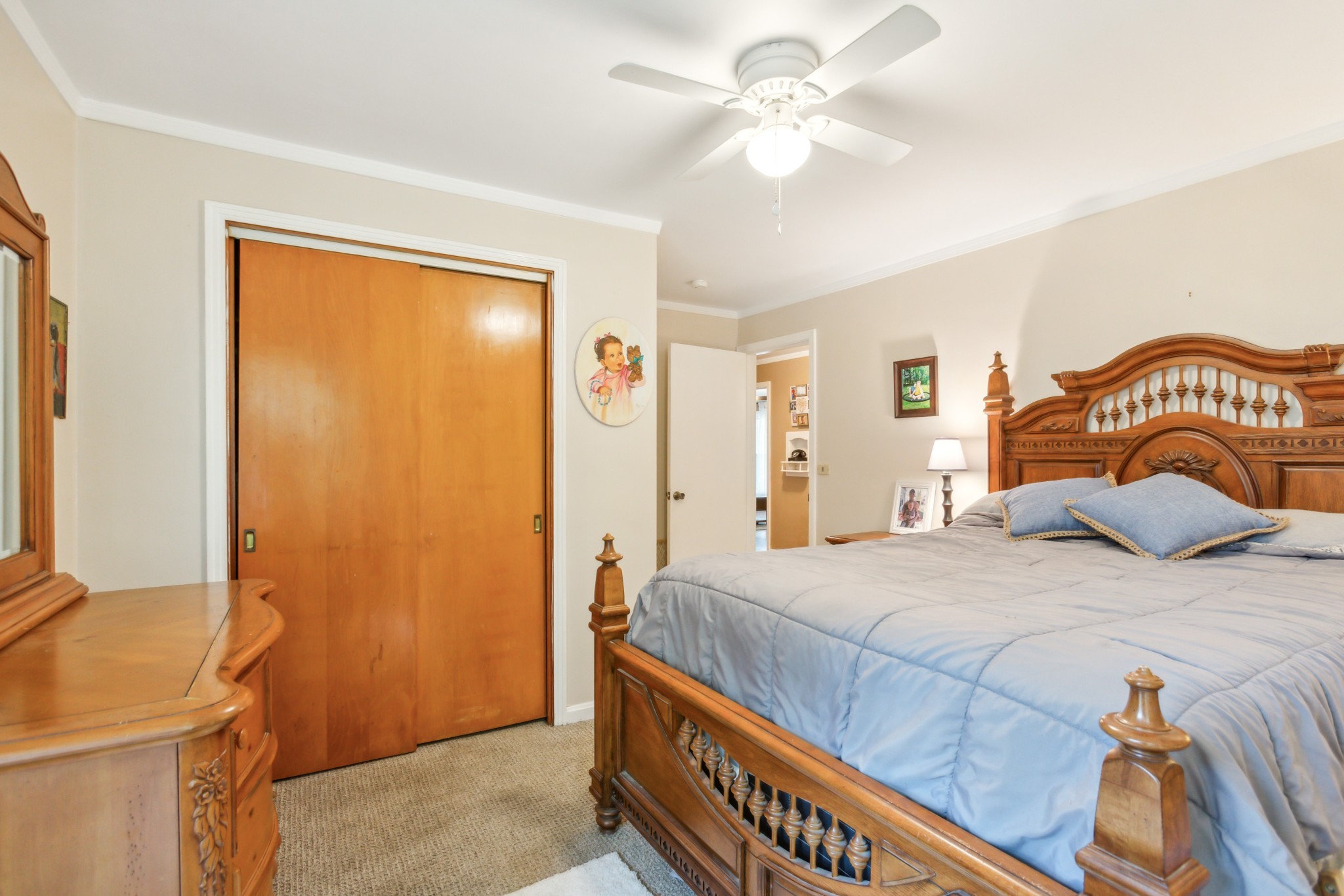 571 Jackson Road Portland, TN 37148 - Photo 16 of 24 a bedroom with a bed and a chandelier