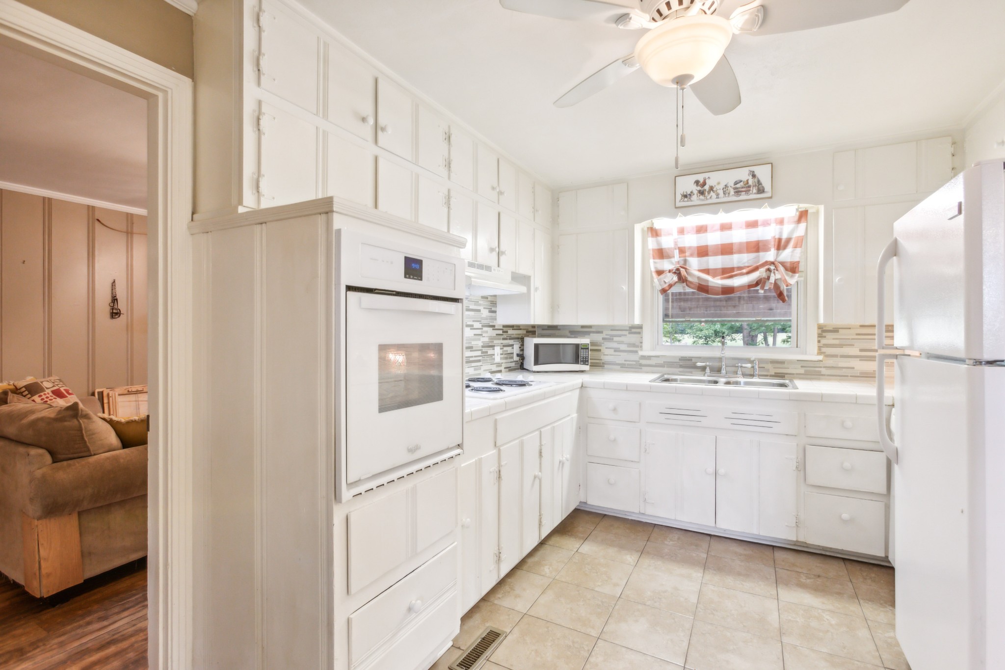 571 Jackson Road Portland, TN 37148 - Photo 9 of 24 a kitchen with white cabinets and white appliances