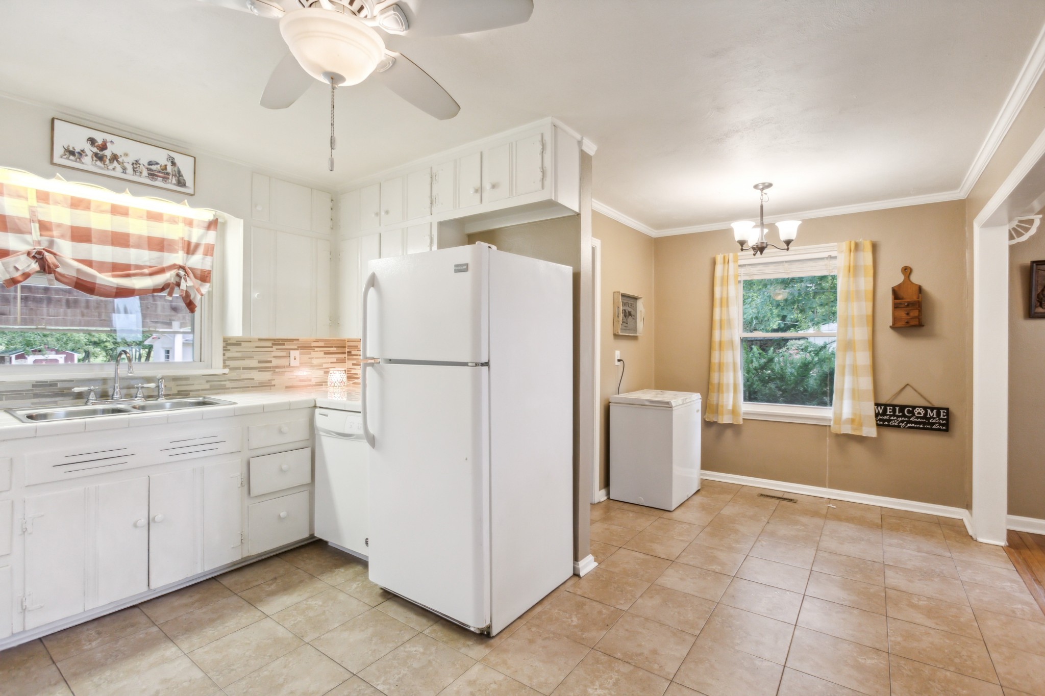 571 Jackson Road Portland, TN 37148 - Photo 10 of 24 a kitchen with a refrigerator a stove a sink and a window