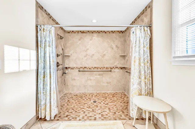 a bathroom with a shower and a toilet