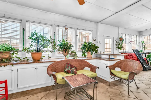 a dining room with furniture and windows