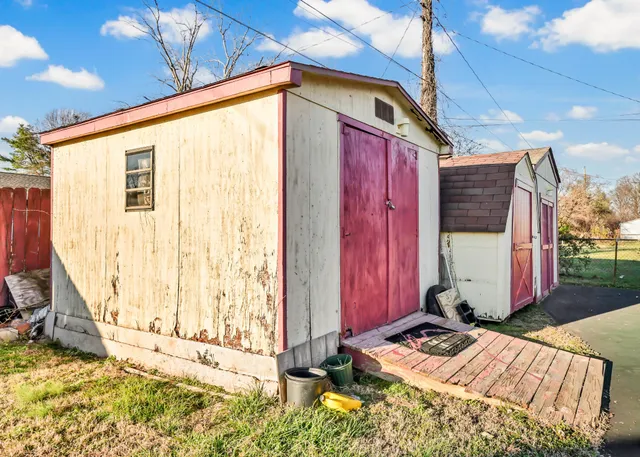 a view of a backyard with a chair and table