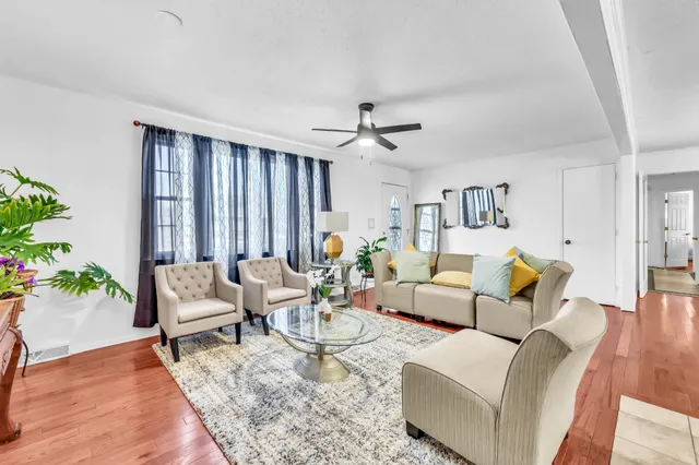 a living room with furniture and a large window