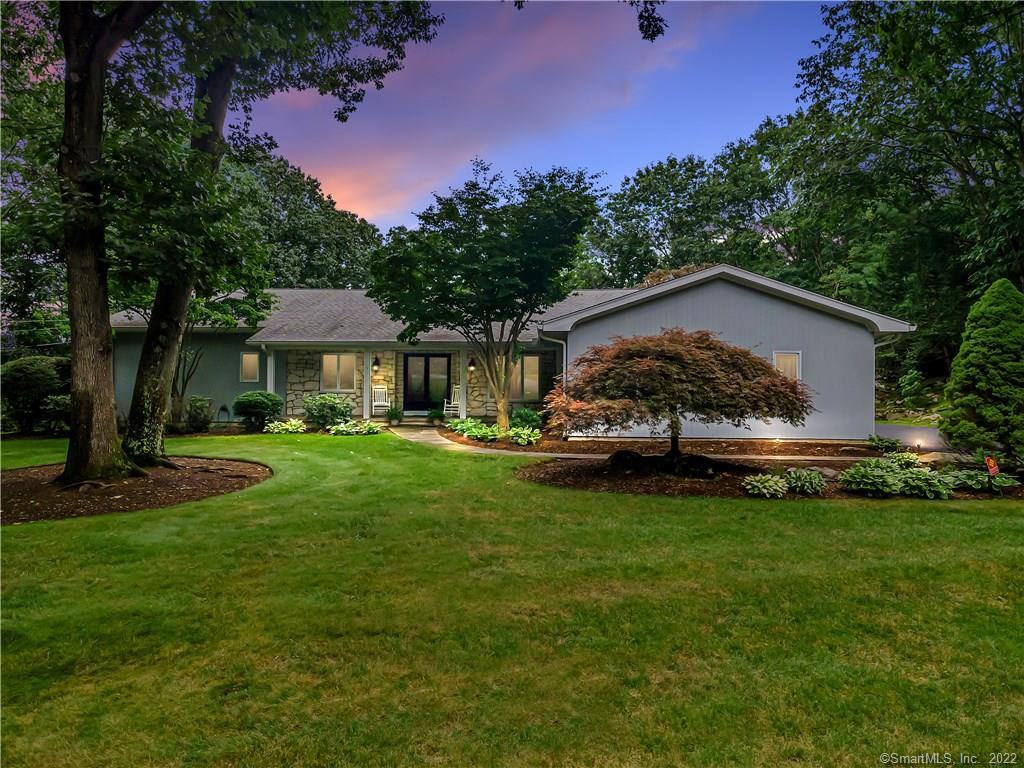 12 Rolling Ridge Road Fairfield, CT 06824 - Photo 1 of 1 a front view of a house with garden