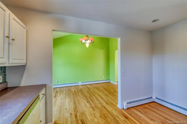 a view of room with wooden floor