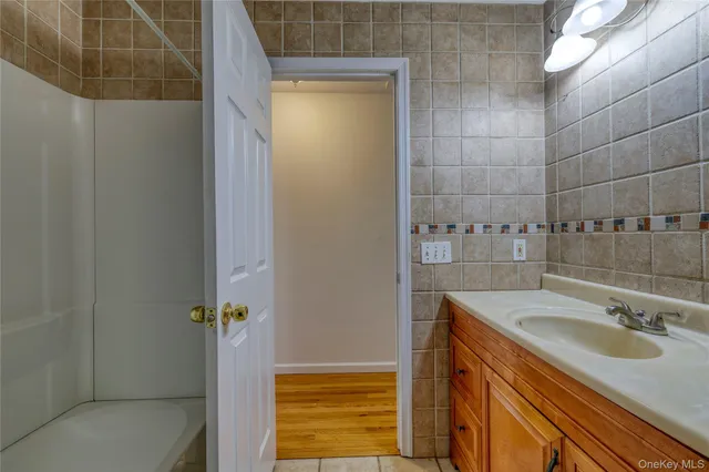 a bathroom with a sink and shower