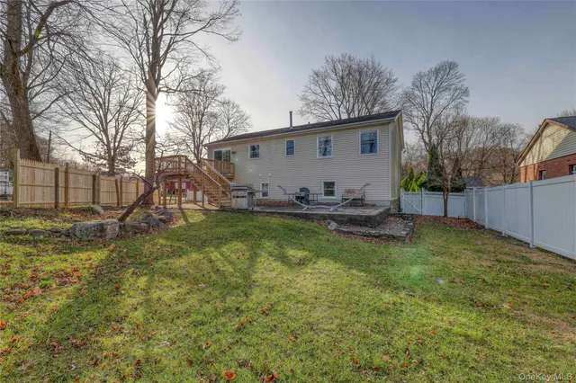 a view of a backyard with a tree