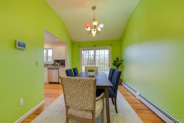 a dining room with furniture and window