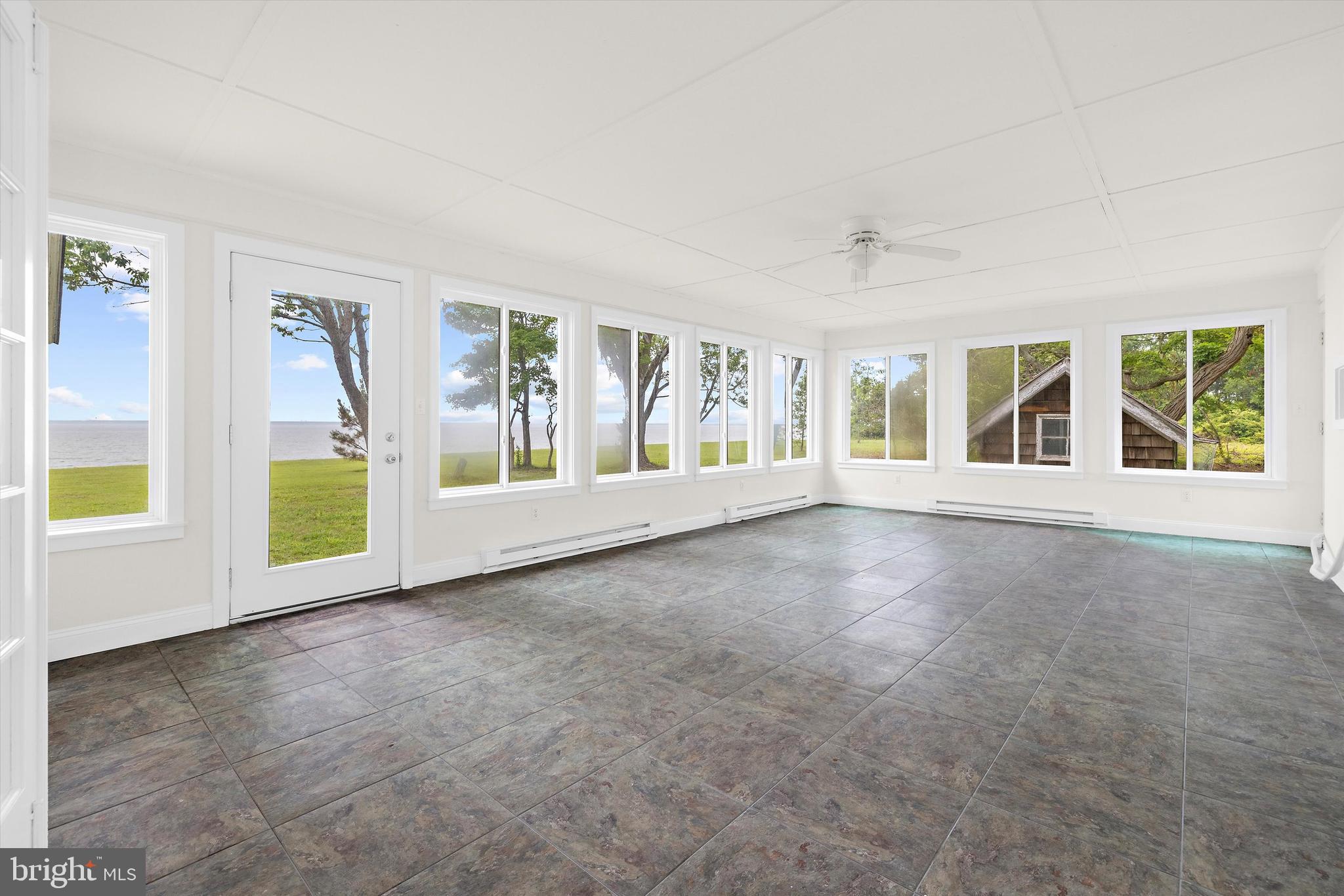 500 Nesbit Road Queenstown, MD 21658 - Photo 15 of 53 wooden floor in an empty room with a window