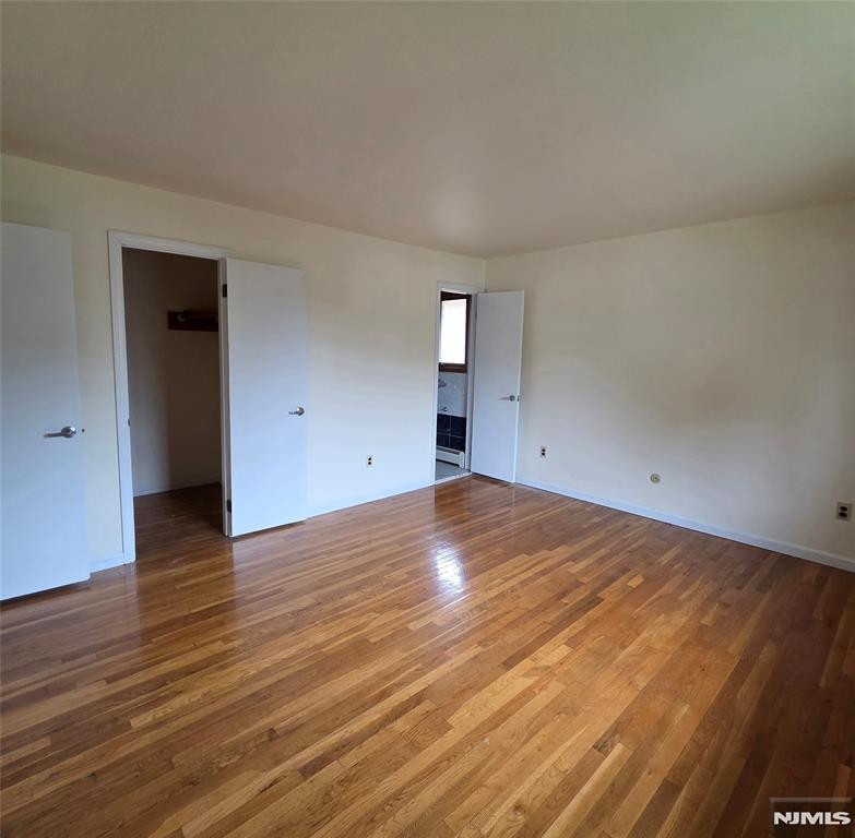 688 Day Avenue, Unit 2 Ridgefield, NJ 07657 - Photo 16 of 18 a view of empty room with wooden floor