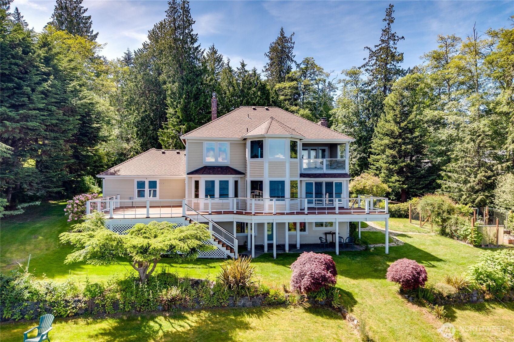 252 Jansen Road Nordland, WA 98358 - Photo 38 of 40 a front view of a house with swimming pool and trees