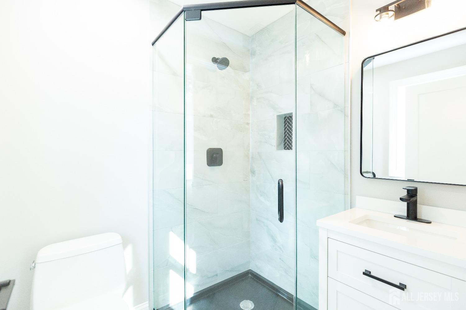 32 Weldon Road Edison, NJ 08817 - Photo 42 of 59 a bathroom with a sink and a mirror