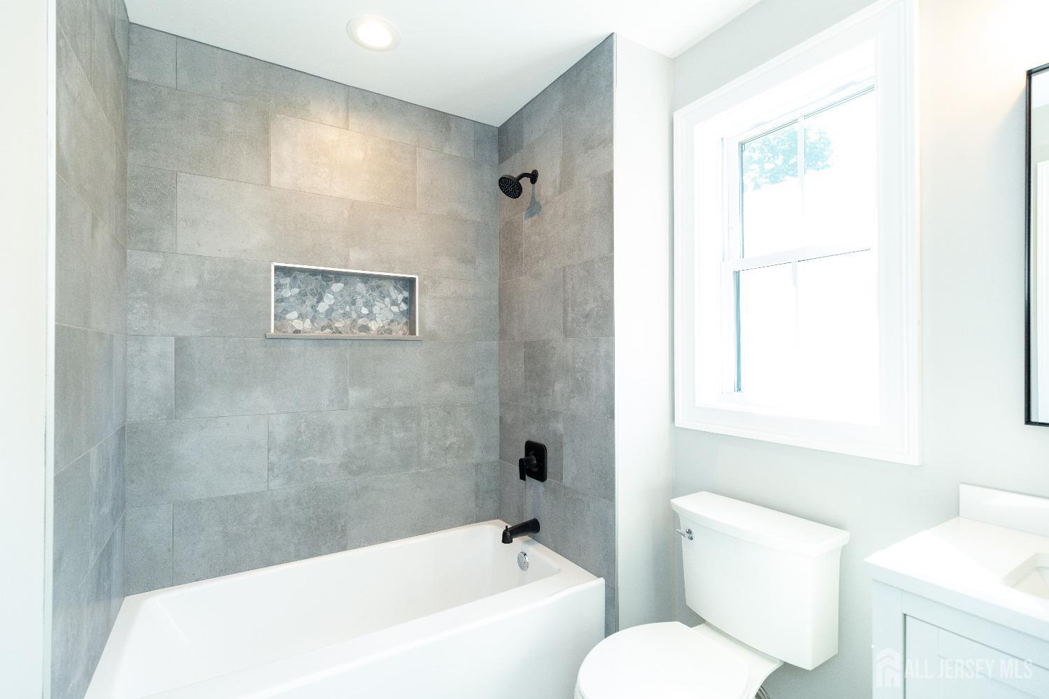 32 Weldon Road Edison, NJ 08817 - Photo 48 of 59 a bathroom with a toilet and a bathtub