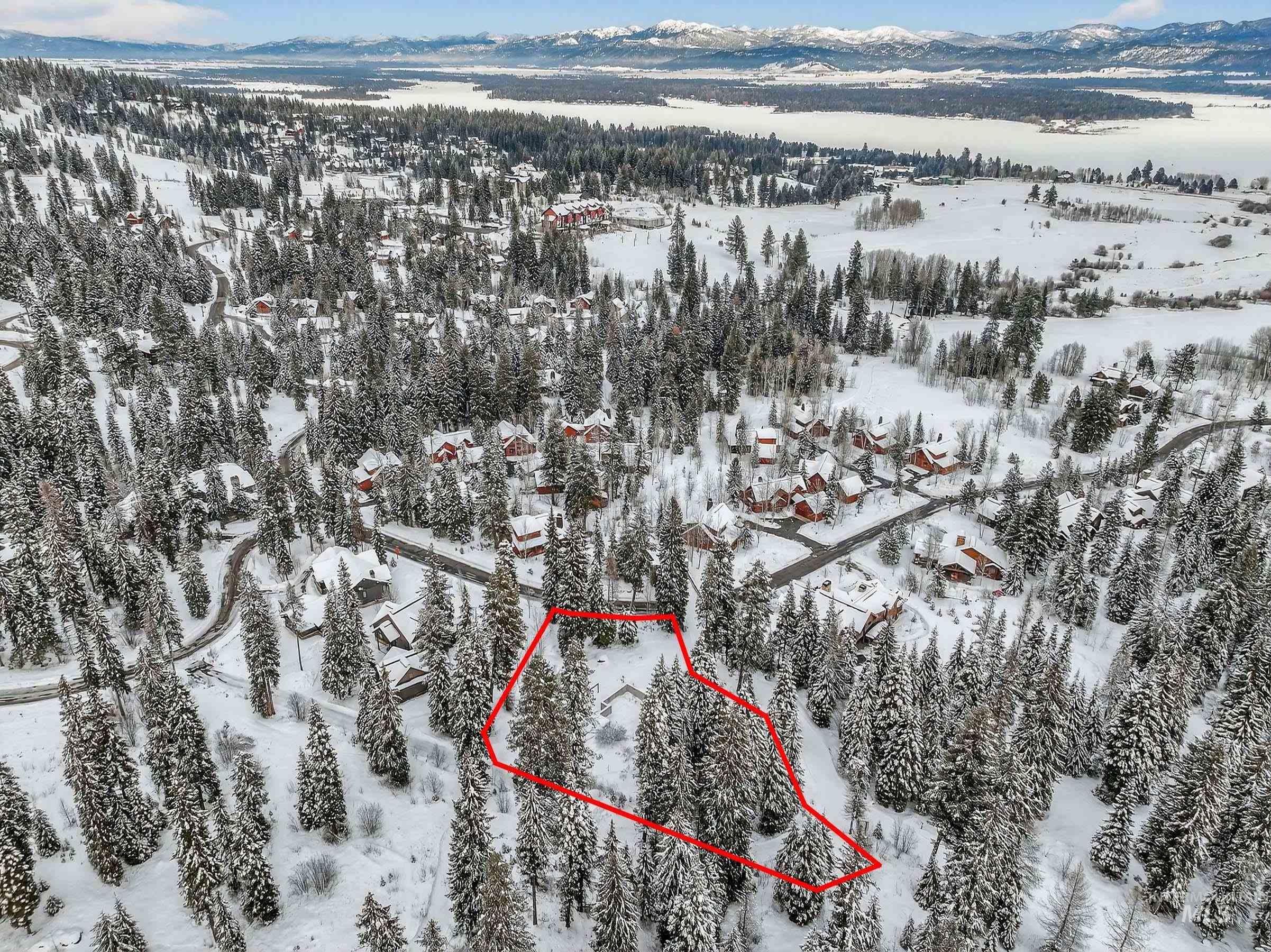 53 Pinnacle Court Cascade, ID 83611 - Photo 14 of 18 Snowy aerial view with property parcel outlined and a mountain view