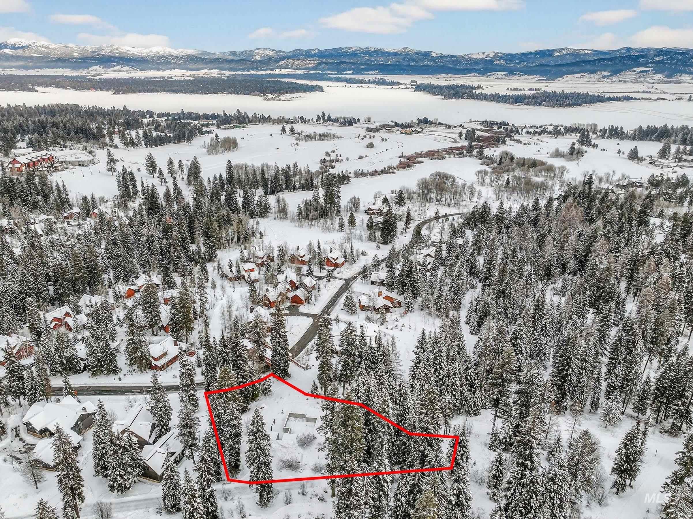 53 Pinnacle Court Cascade, ID 83611 - Photo 15 of 18 Snowy aerial view featuring property parcel outlined and a mountain view