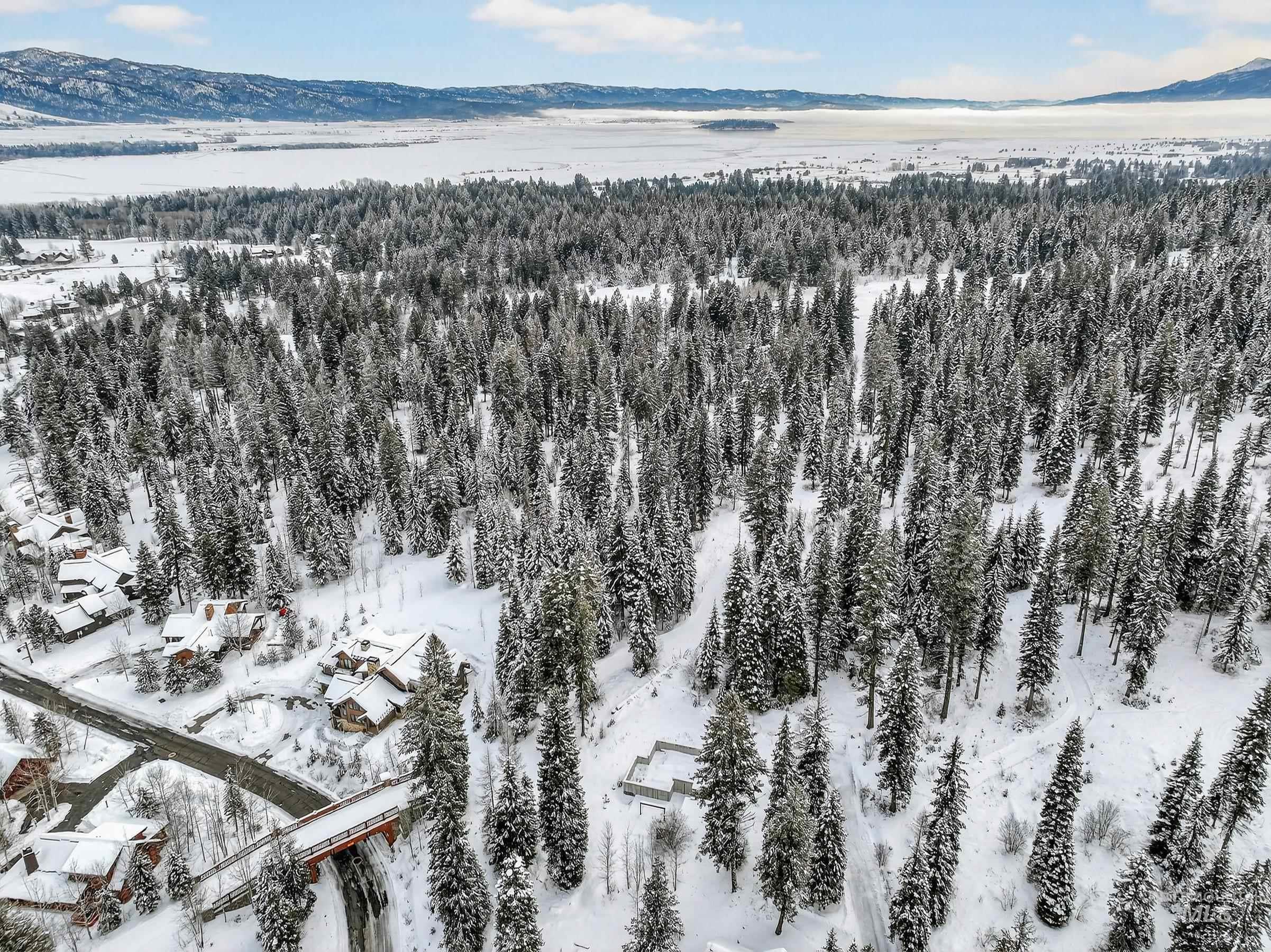 53 Pinnacle Court Cascade, ID 83611 - Photo 10 of 18 Snowy aerial view with a mountain view