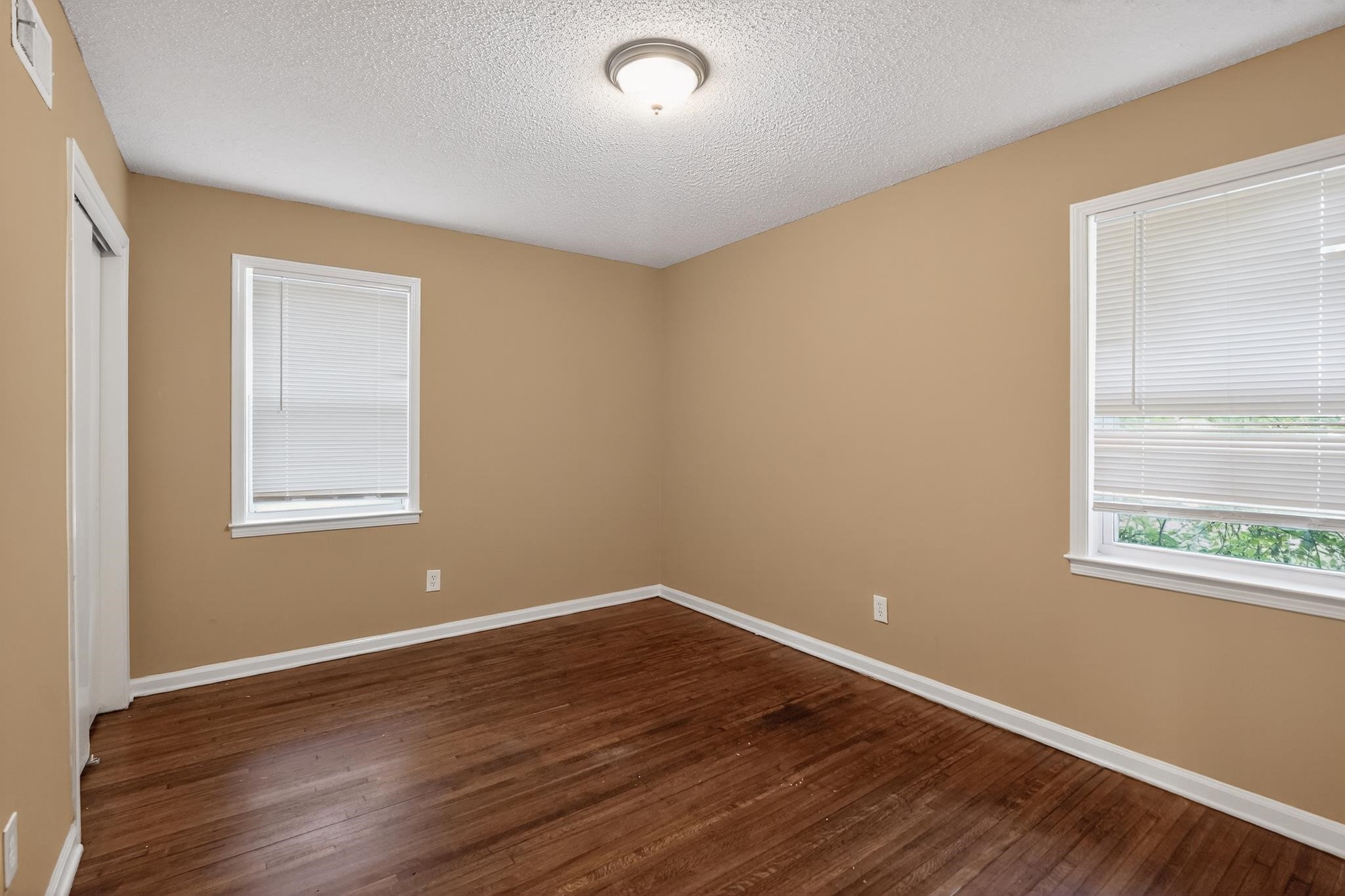 2015 East Holmes Road Memphis, TN 38116 - Photo 25 of 34 a view of a room with wooden floor and windows in it