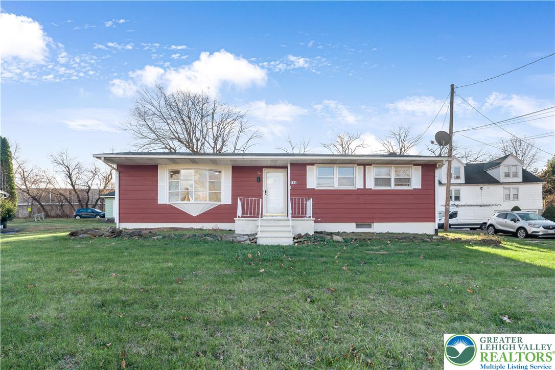 416 Main Street Stockertown, PA 18083 - Photo 1 of 29 a front view of a house with a yard and garage