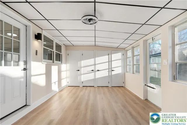 an empty room with wooden floor