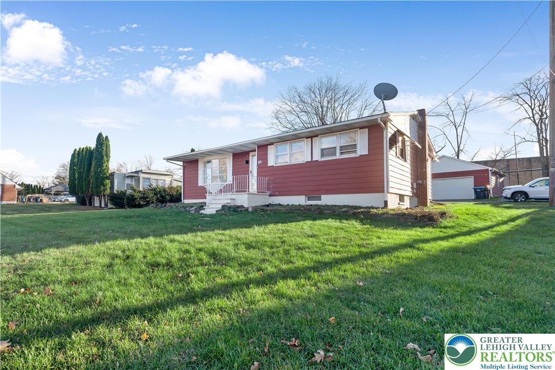 416 Main Street Stockertown, PA 18083 - Photo 2 of 29 a front view of a house with garden