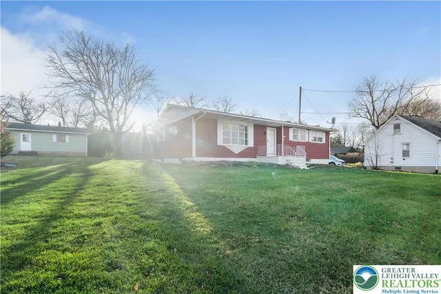 a kitchen with stainless steel appliances a refrigerator sink and cabinets