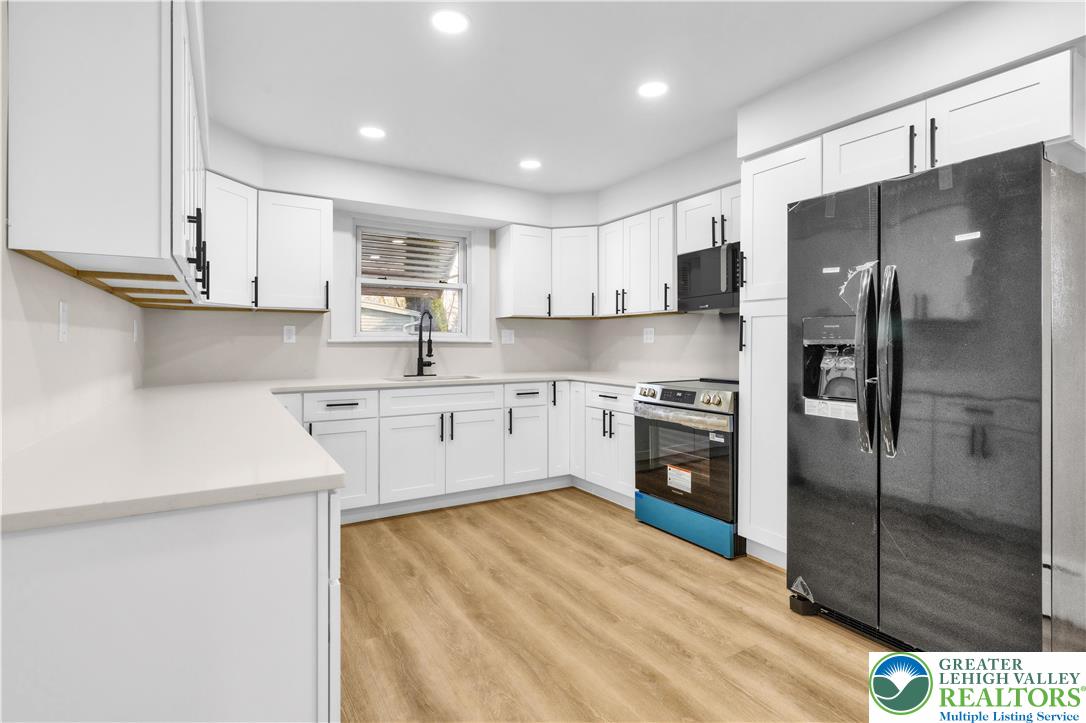 416 Main Street Stockertown, PA 18083 - Photo 4 of 29 a kitchen with stainless steel appliances a refrigerator sink and cabinets