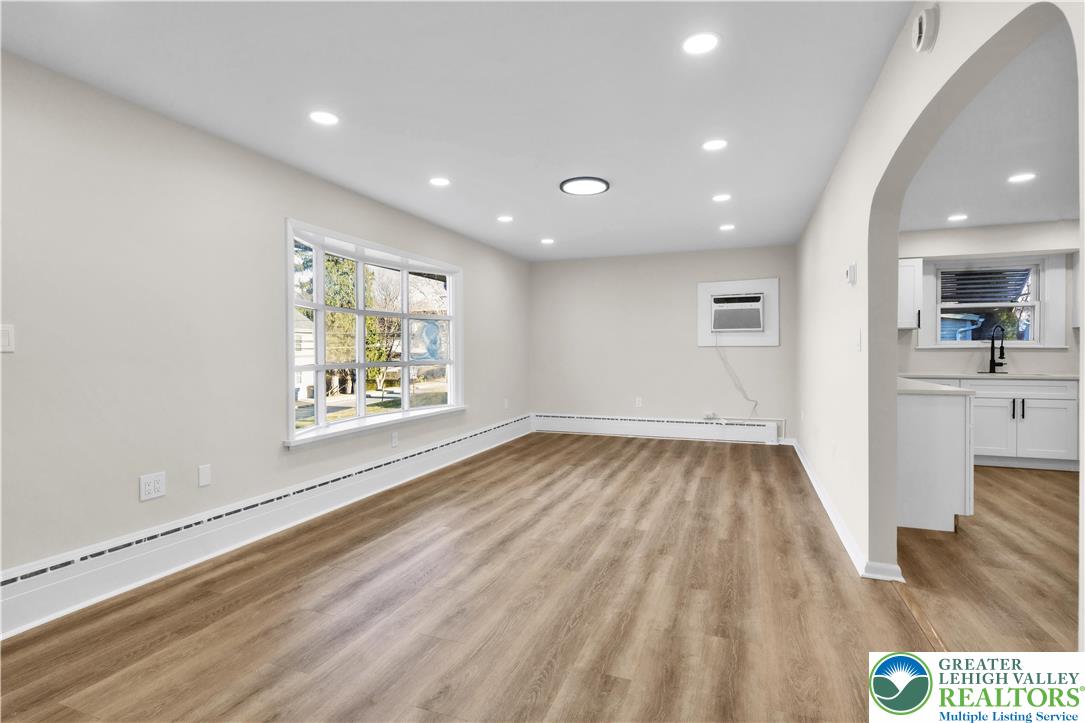 416 Main Street Stockertown, PA 18083 - Photo 9 of 29 an empty room with wooden floor and windows