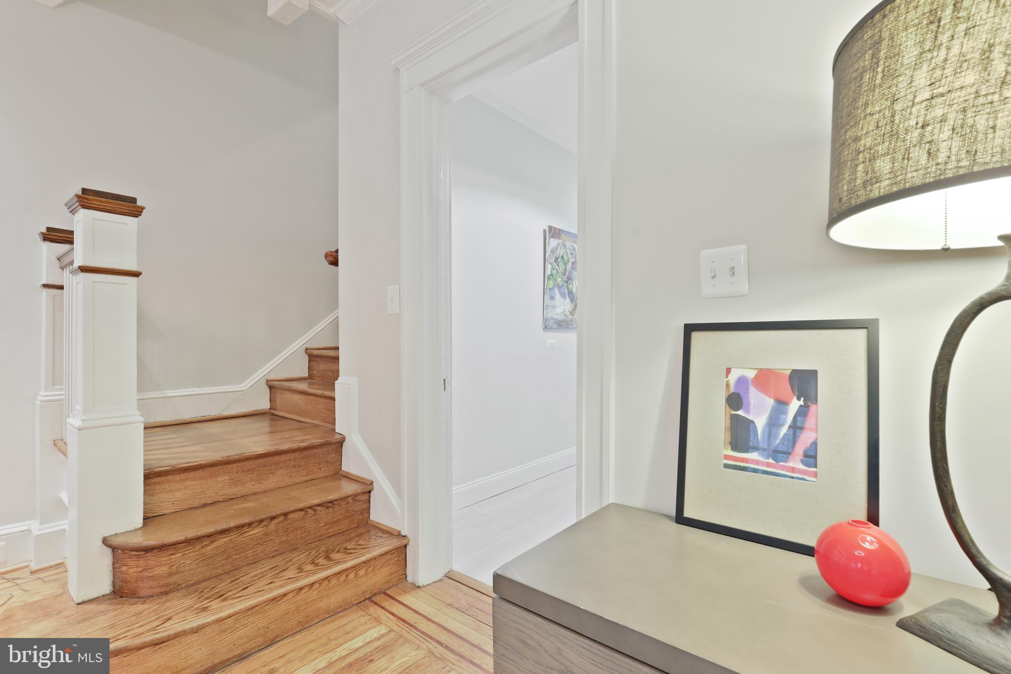 4304 Roland Avenue Baltimore, MD 21210 - Photo 13 of 45 LR hardwood staircase newly refinished