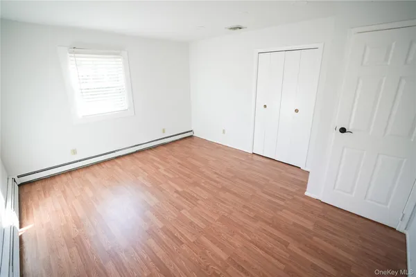 a room with furniture and wooden floor
